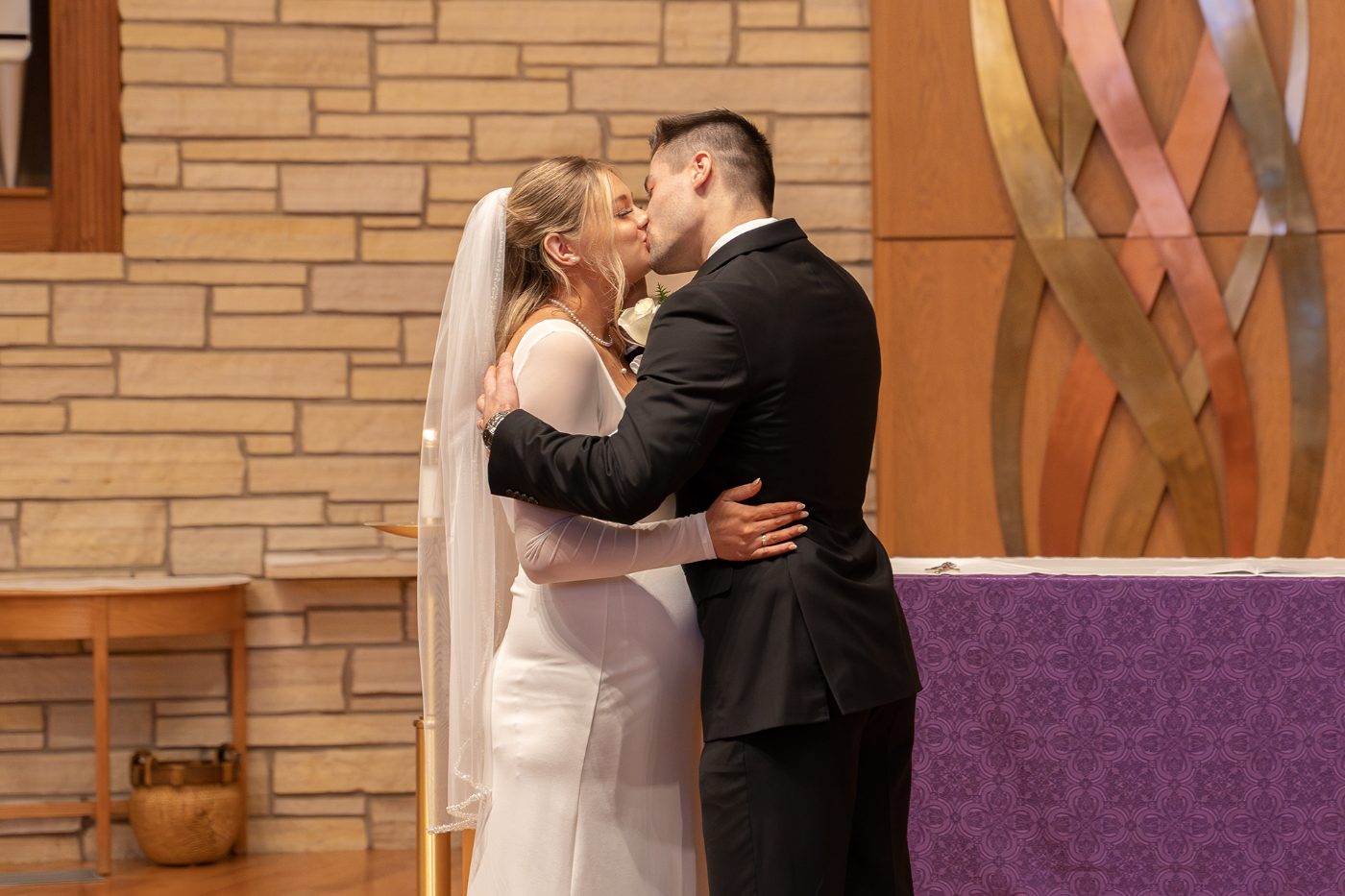 Ceremony kiss at the altar